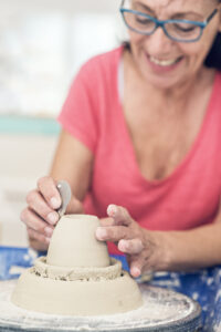 Tsami Ceramics | Art Studio Corfu woman creating a clay mug